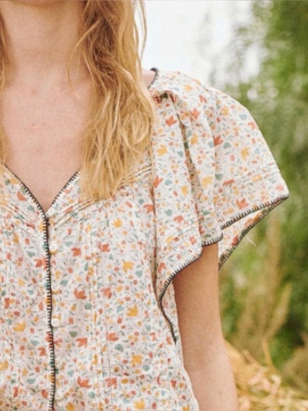 The GREAT. The Whip Stitched Flounce Blouse